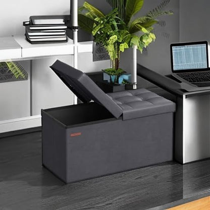 SONGMICS MAZIE Collection - 30 Inches Storage Ottoman Bench with Flipping Lid, Storage Chest Footstool, Load 660 lb, for Entryway, Living Room, Bedroom, Synthetic Leather, Dark Gray ULSF045G01