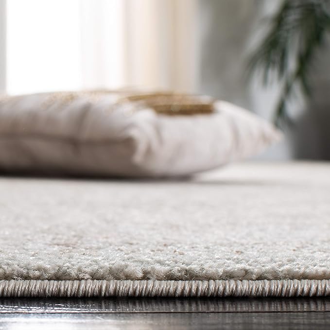 SAFAVIEH Evoke Collection Area Rug - 6'7" x 9', Ivory & Taupe, Distressed Design, Non-Shedding & Easy to Clean, Ideal for Living Room, Bedroom, Dining Space (EVK256E)