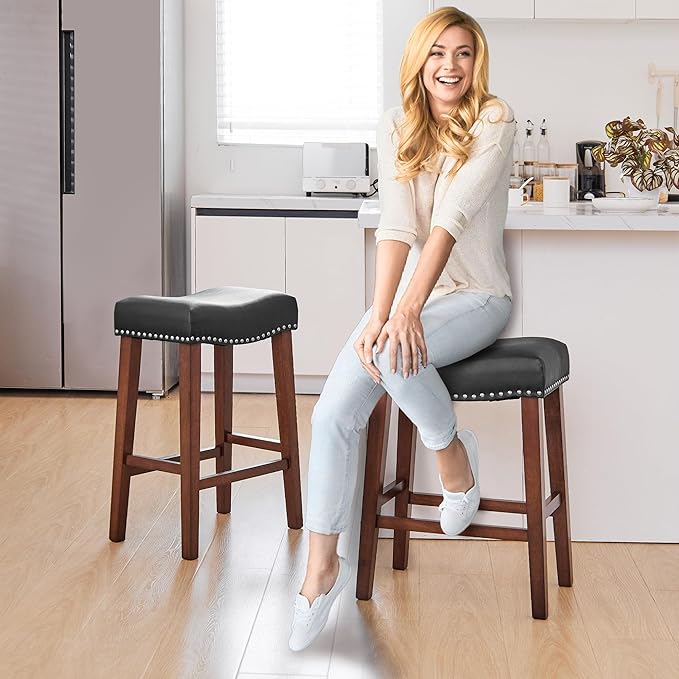 PrimeZone Counter Height Bar Stools Set of 4 - Backless Saddle Barstools with 4.3" Thick Upholstered, Nailhead Trim Faux Leather & Solid Wood Legs, 26 Inch Counter Stools for Kitchen Island, Black